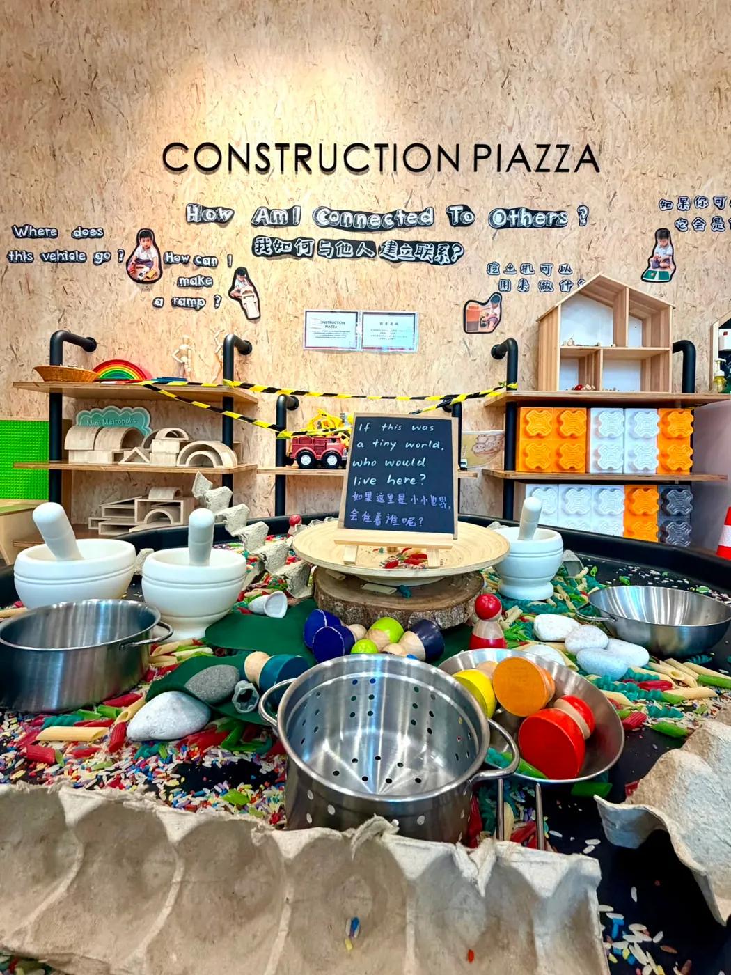 The Construction Piazza sensory tray with blocks, tools and the question How am I connected to others